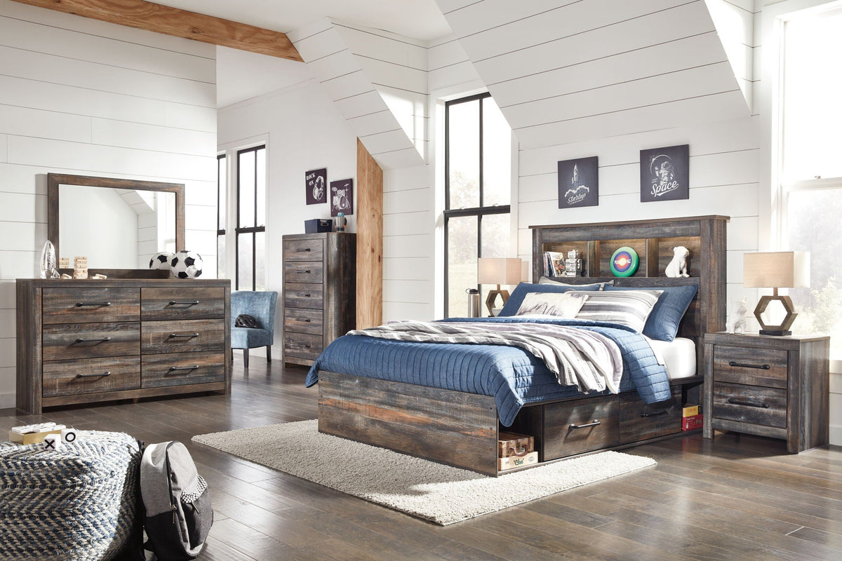 Dark wood storage bed with bookcase headboard and lower drawers, blue bedding