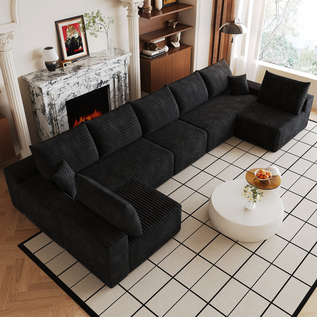 Dark plush corduroy U-shaped sectional sofa with deep seat, thick arms, and back pillows