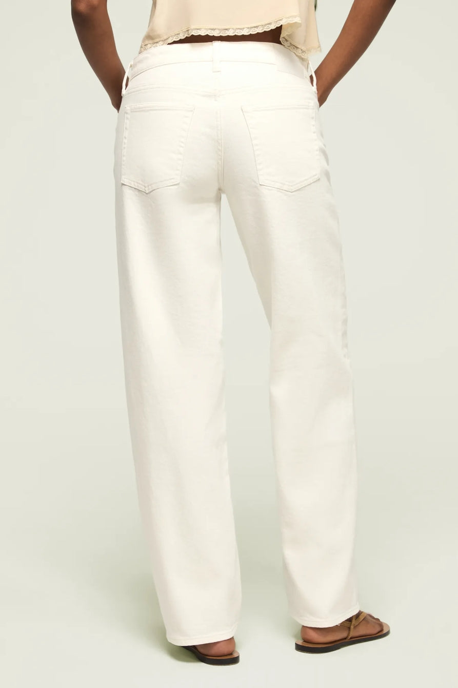 Women's baggy white jeans, back view with yoke and two rear patch pockets