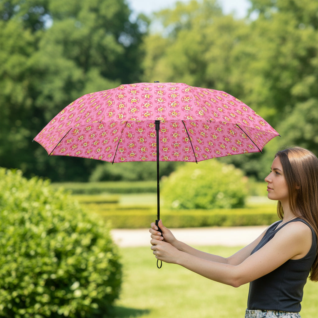 Pink compact umbrella with cat and flower print, open canopy