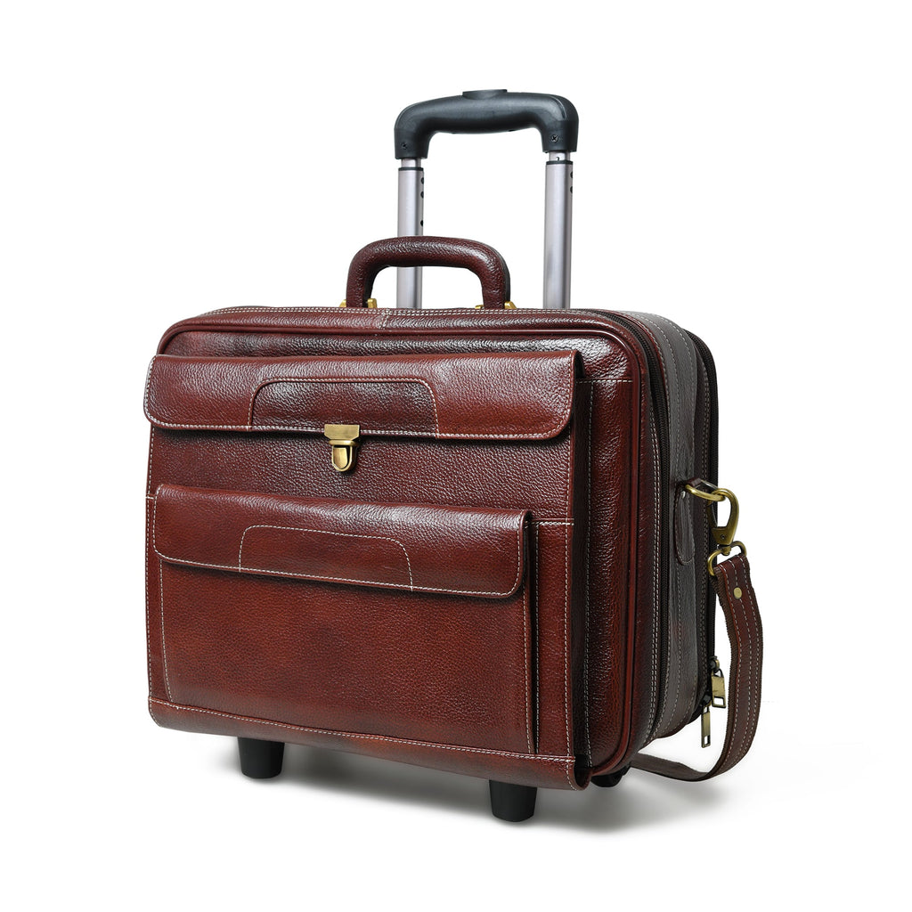 Brown leather trolley suitcase bag with top handle, front flap pocket, and wheels