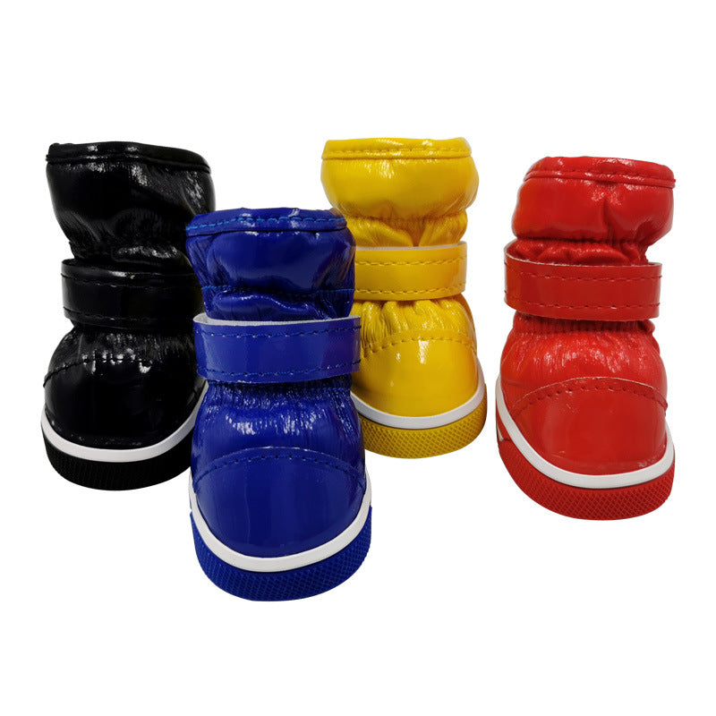 Pet ski boots in black, blue, yellow, and red, with white rubber soles and straps