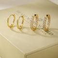 Gold hoop earring set with pave crystal accents, assorted sizes