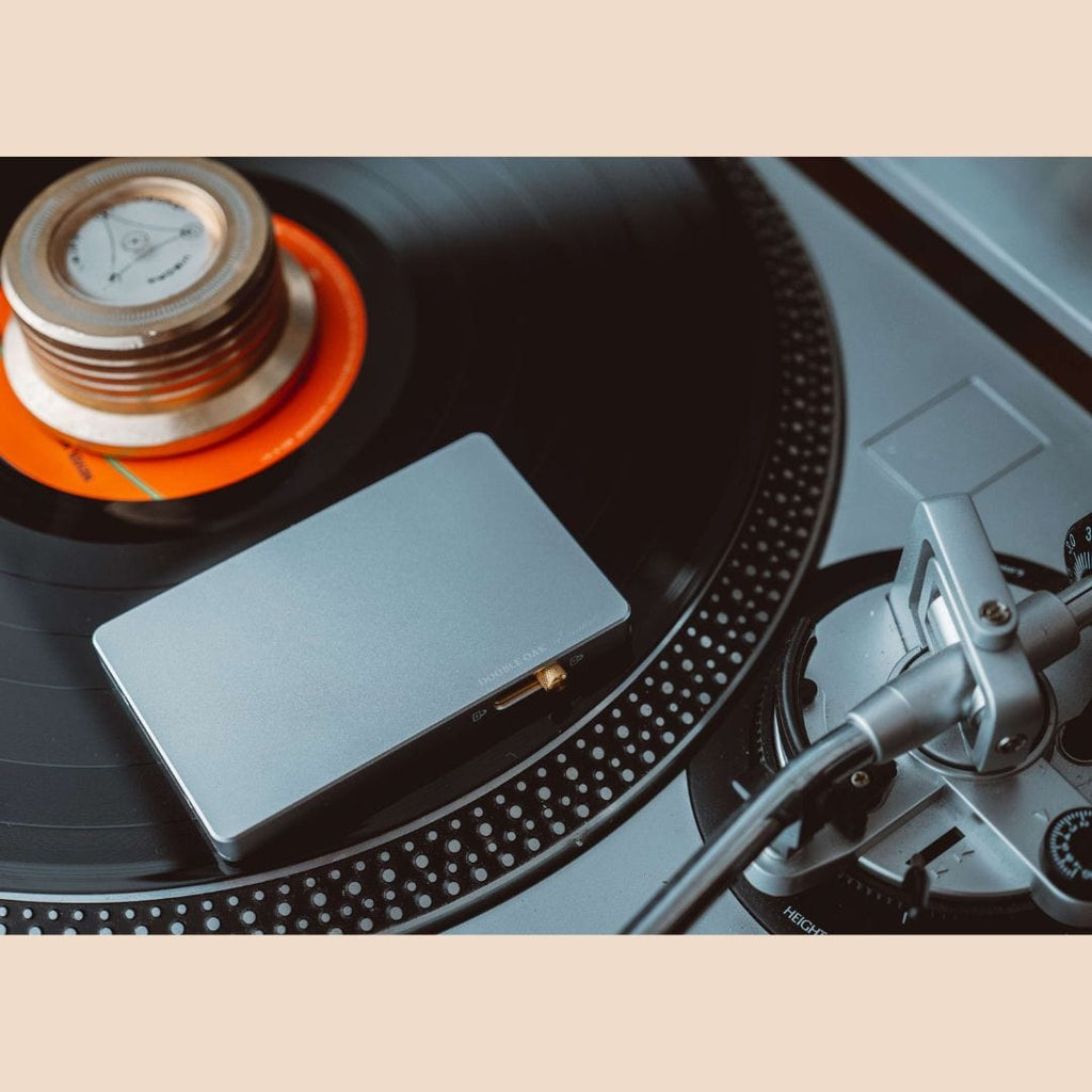 Light blue pop-up cardholder with card visible, placed on turntable