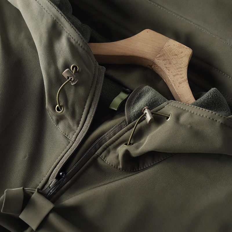 Men's waterproof shell jacket sleeve detail with drawstring cord and zip pocket