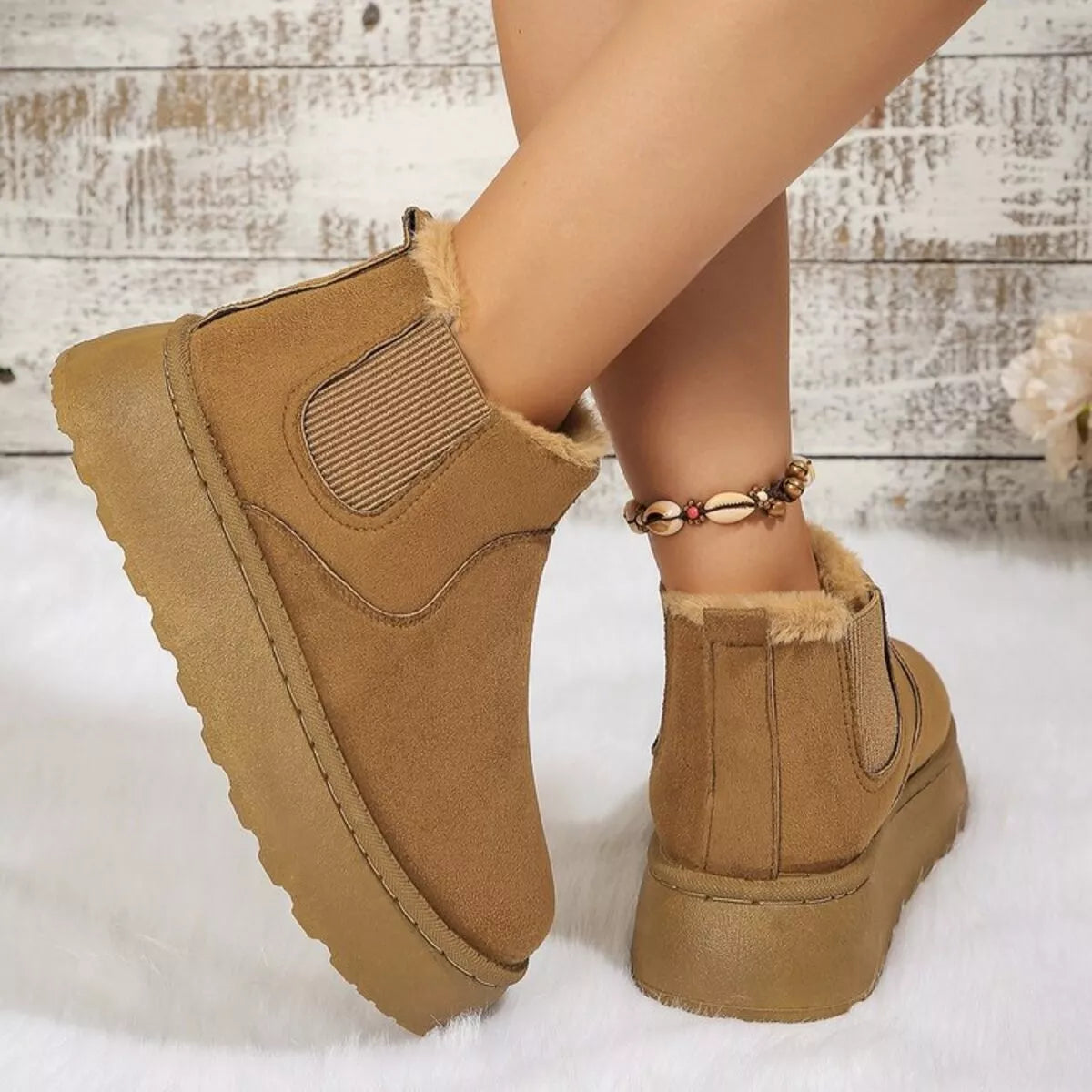 Tan suede platform ankle boots with round toe, side elastic gore, and faux fur trim