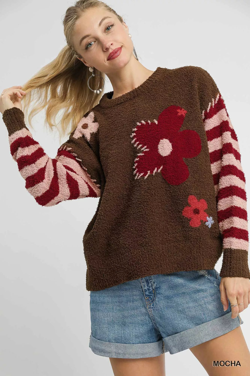 Mocha brown sweater with red flower jacquard and striped sleeves