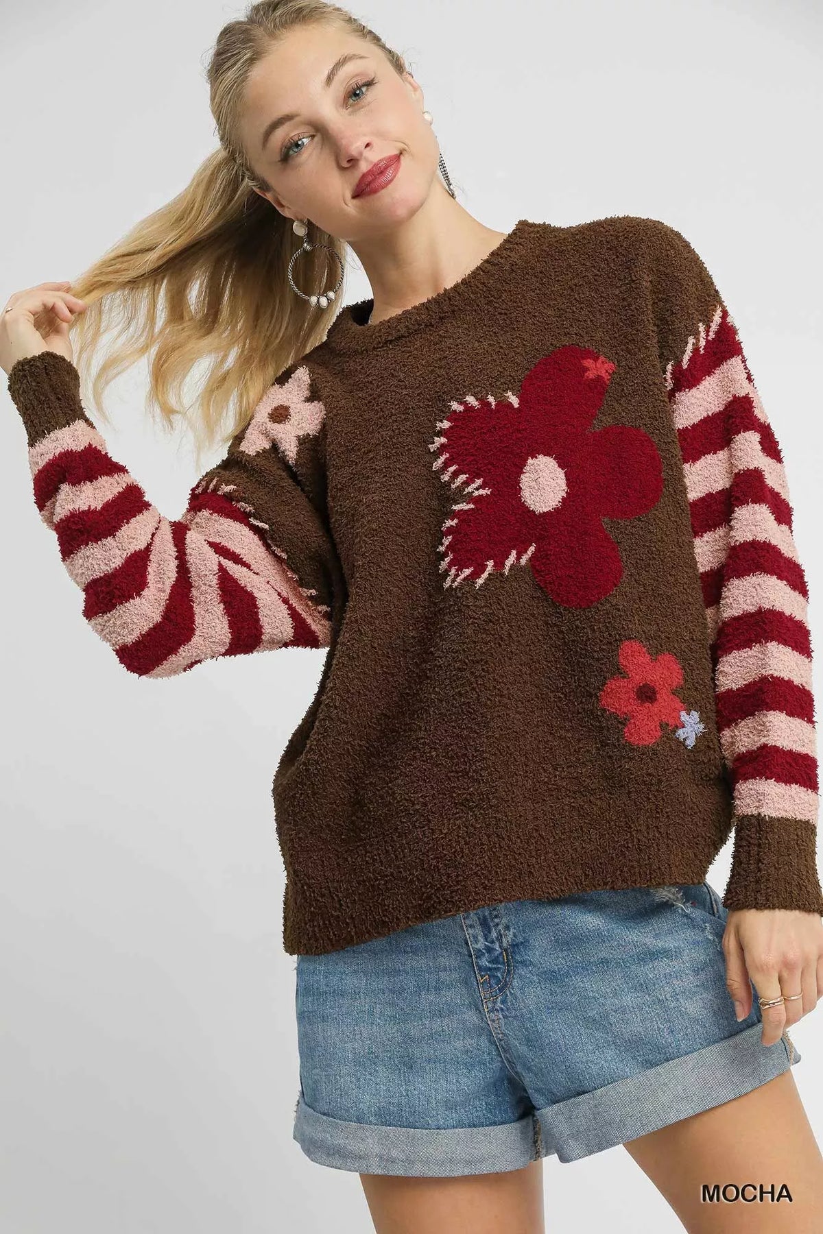 Mocha brown sweater with red flower jacquard and striped sleeves