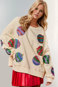 Cream long-sleeve sweatshirt with sequin candy-cane heart patches, round neck