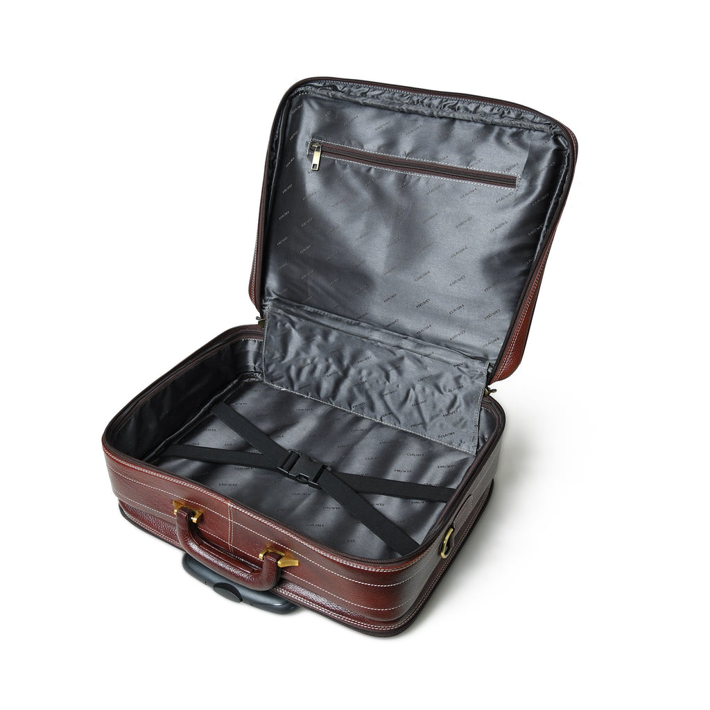 Brown leather trolley suitcase bag open, showing dark interior lining and secure front straps