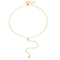 Gold-tone chain necklace with a small faceted teardrop crystal charm