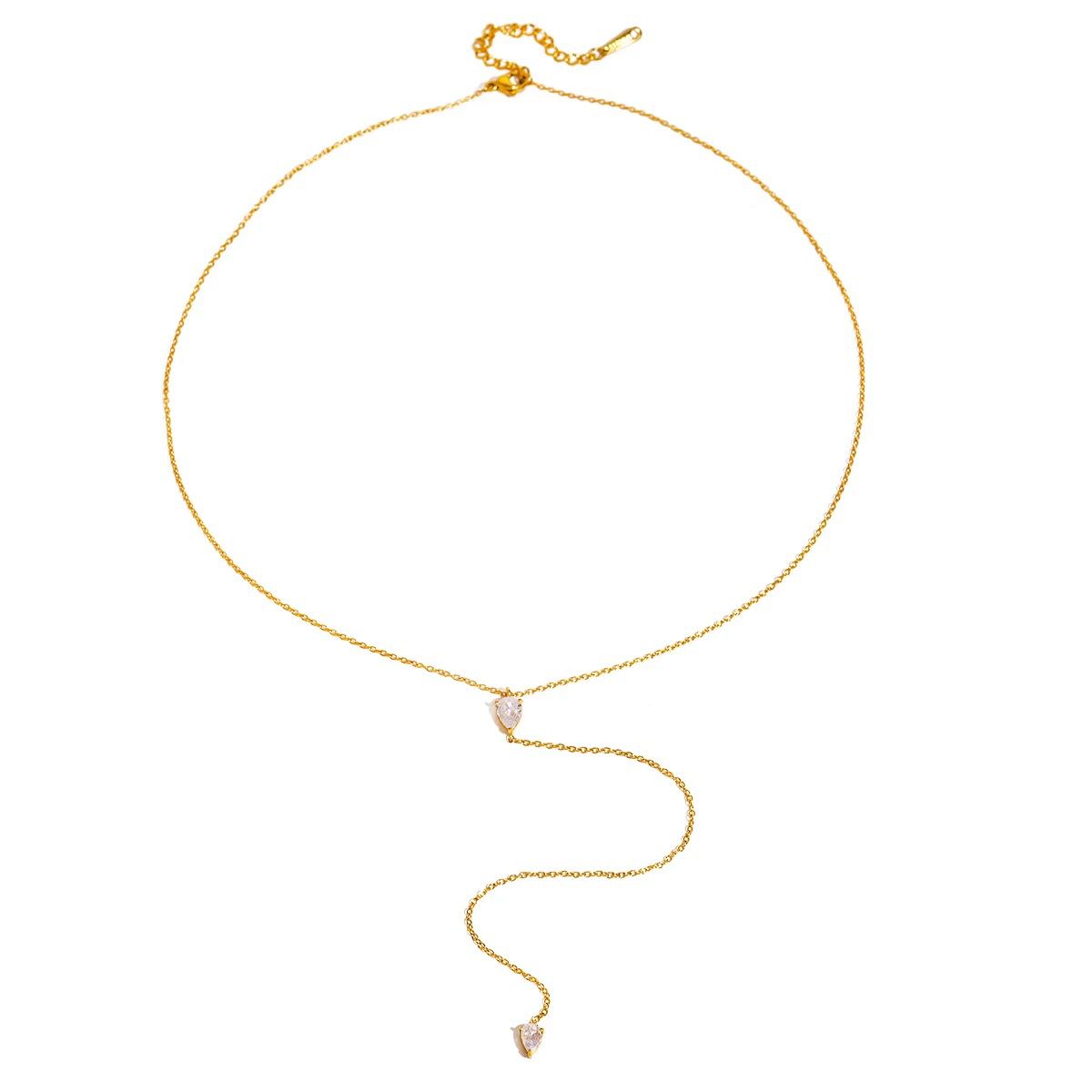 Gold-tone chain necklace with a small faceted teardrop crystal charm