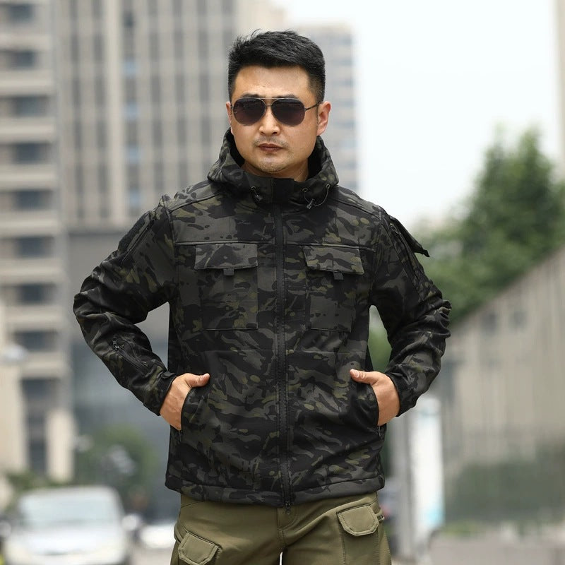 Dark camo tactical shell jacket with stand collar and zip-front utility pockets.