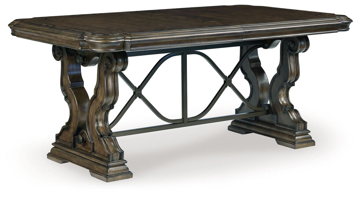 Dark brown dining extension table with carved cabriole-style legs and cross-brace