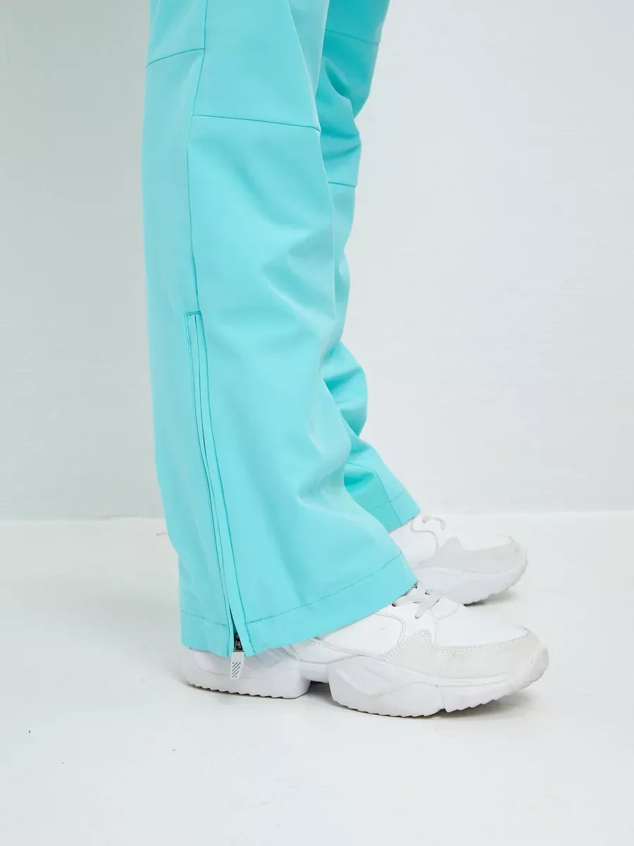 Mint insulated ski jumpsuit lower leg with front zipper and white boot footwear