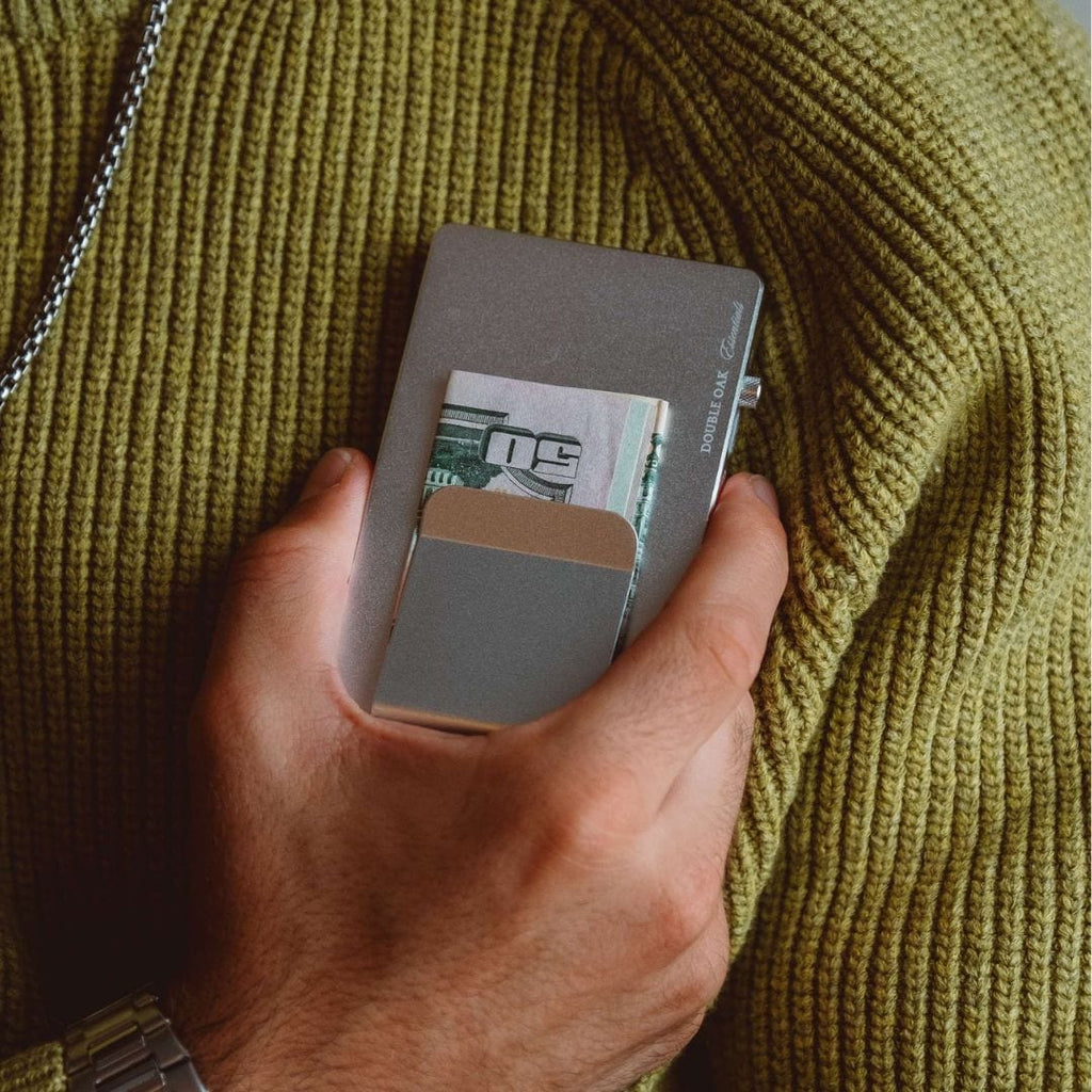 Gray pop-up cardholder open, showing card slots and front logo.