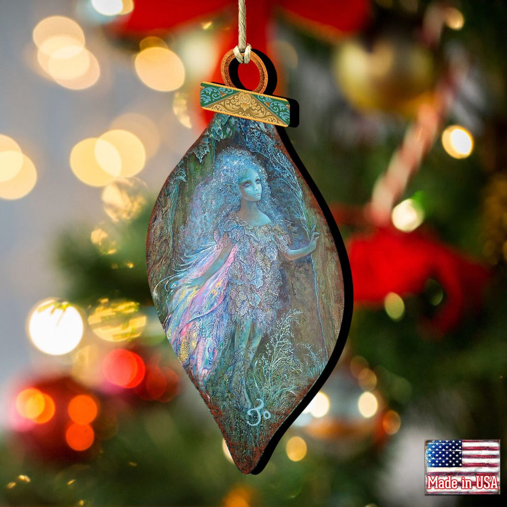 Teardrop wooden forest fairy ornament with blue fairy painting, hanging loop on a decorated tree.