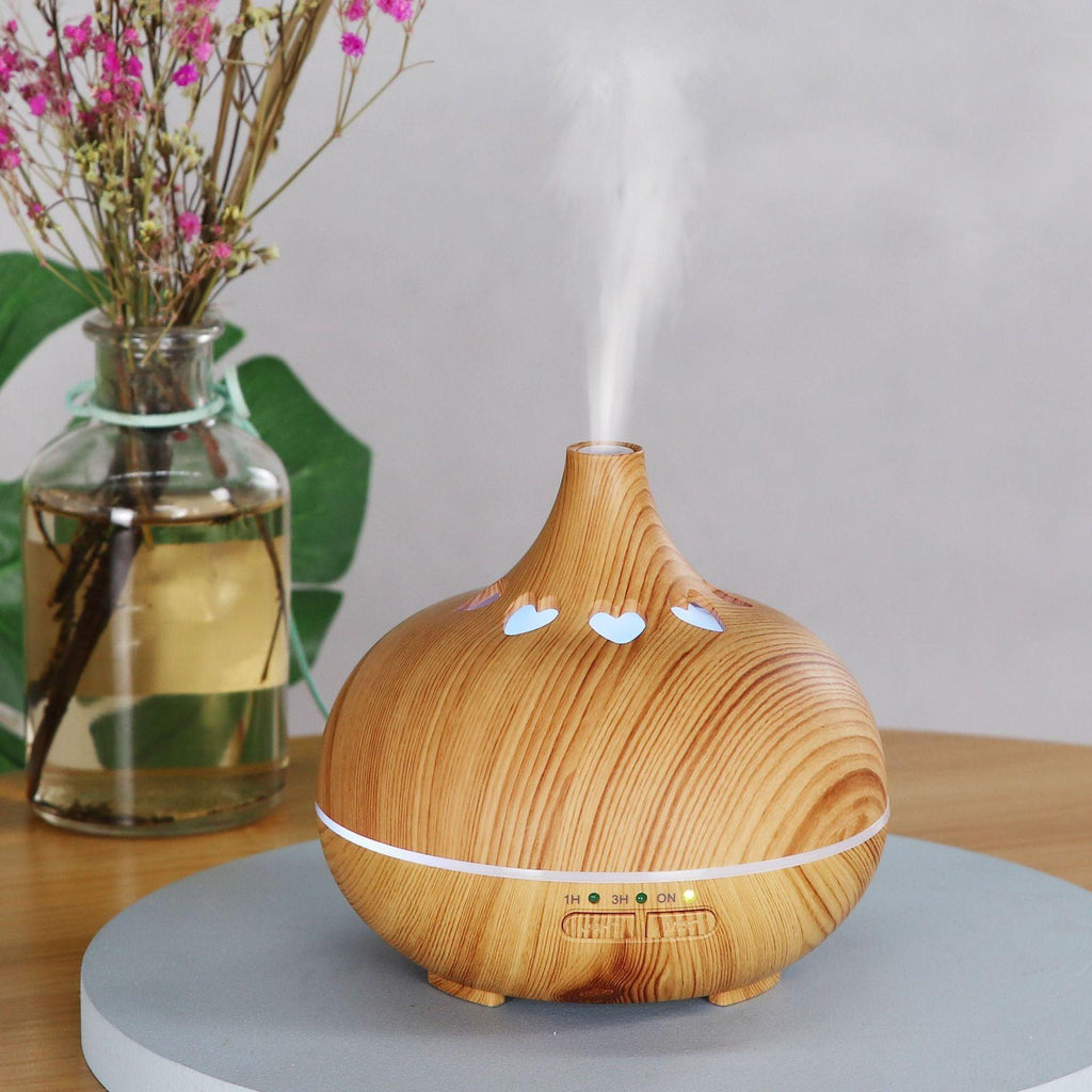 Wood-grain aromatherapy diffuser with white heart LED lights and mist
