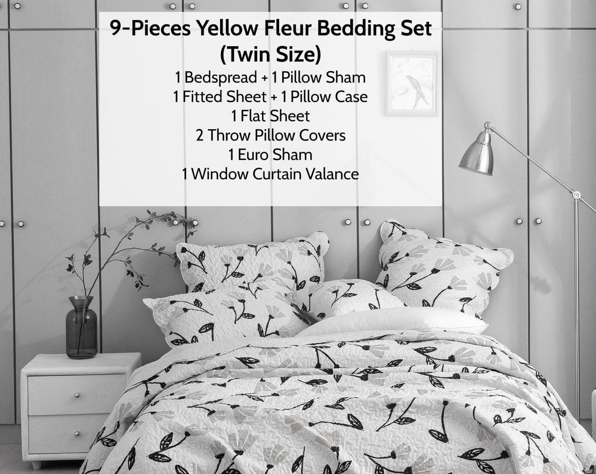 Floral botanical bedding set in white with dark leaves and yellow flower print on bed