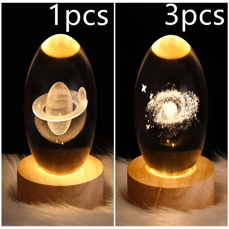 LED galaxy crystal ball lamp with floating planet and star-dust glow; wooden base