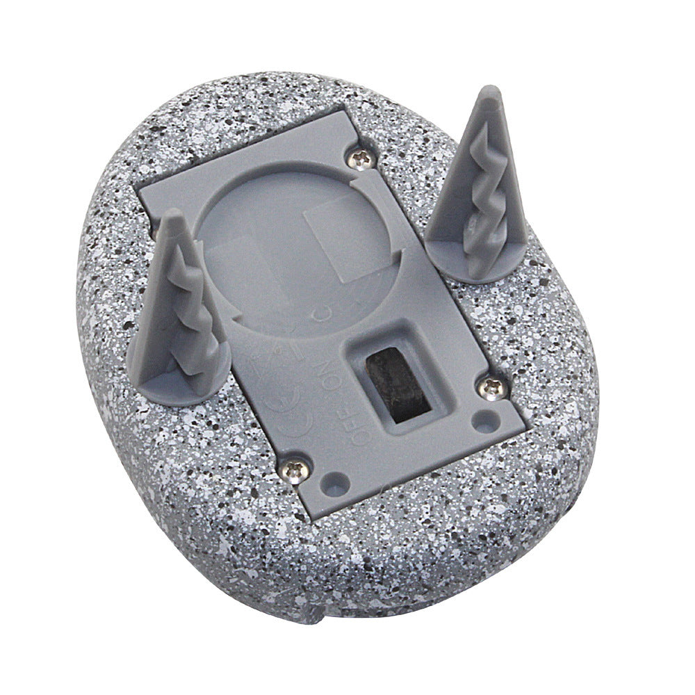 Grey speckled oval solar garden lamp underside with solar cell and supports