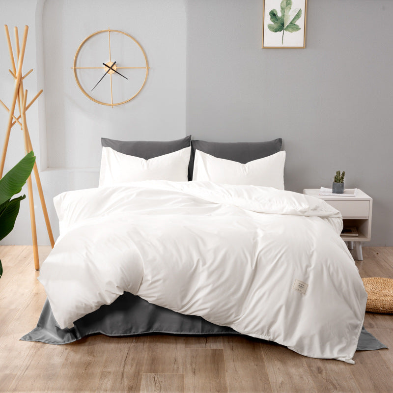 White and dark gray bedding set with matching pillowcases and duvet cover