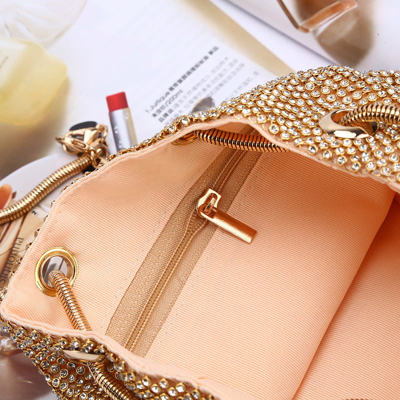Gold crystal beaded clutch with satin interior and metal clasp frame