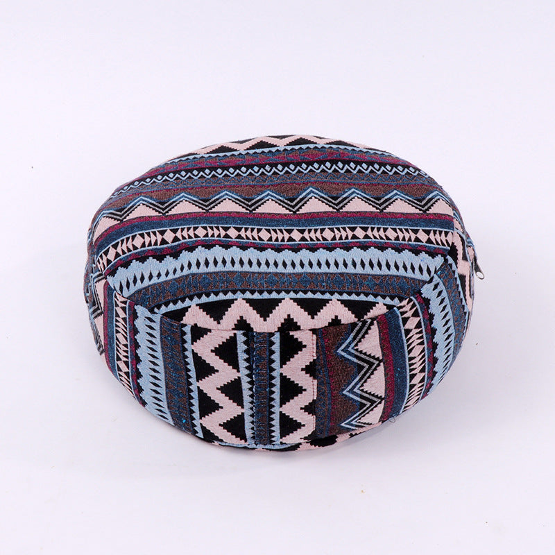 Yoga meditation cushion with bold tribal geometric print, round-oval shape in navy and burgundy