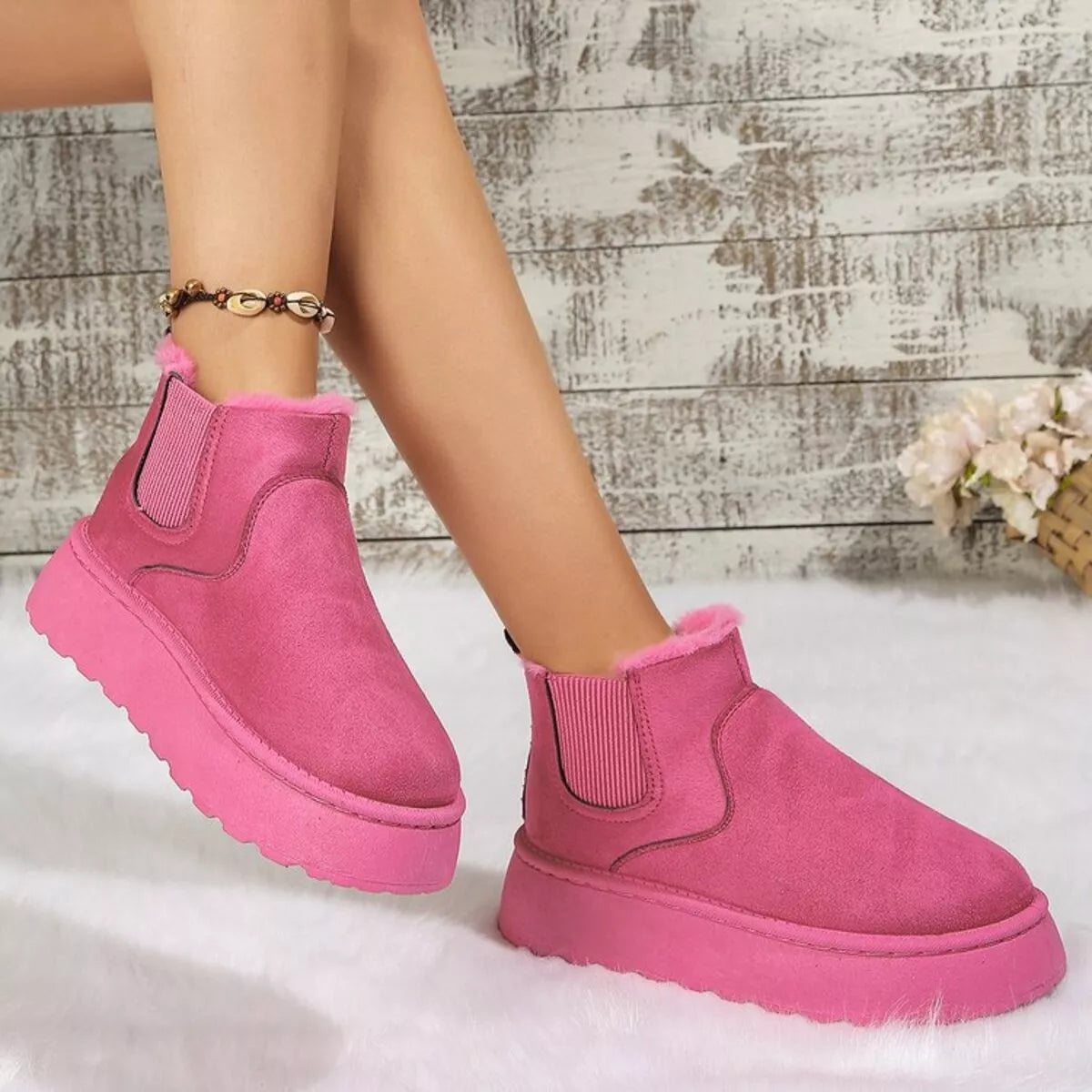 Hot pink suede platform ankle boots with round toe, side elastic gore, and fuzzy lining