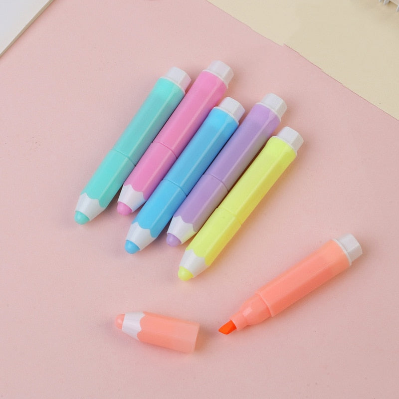 Pastel mini highlighters with exposed chisel tips; coral orange and yellow included.