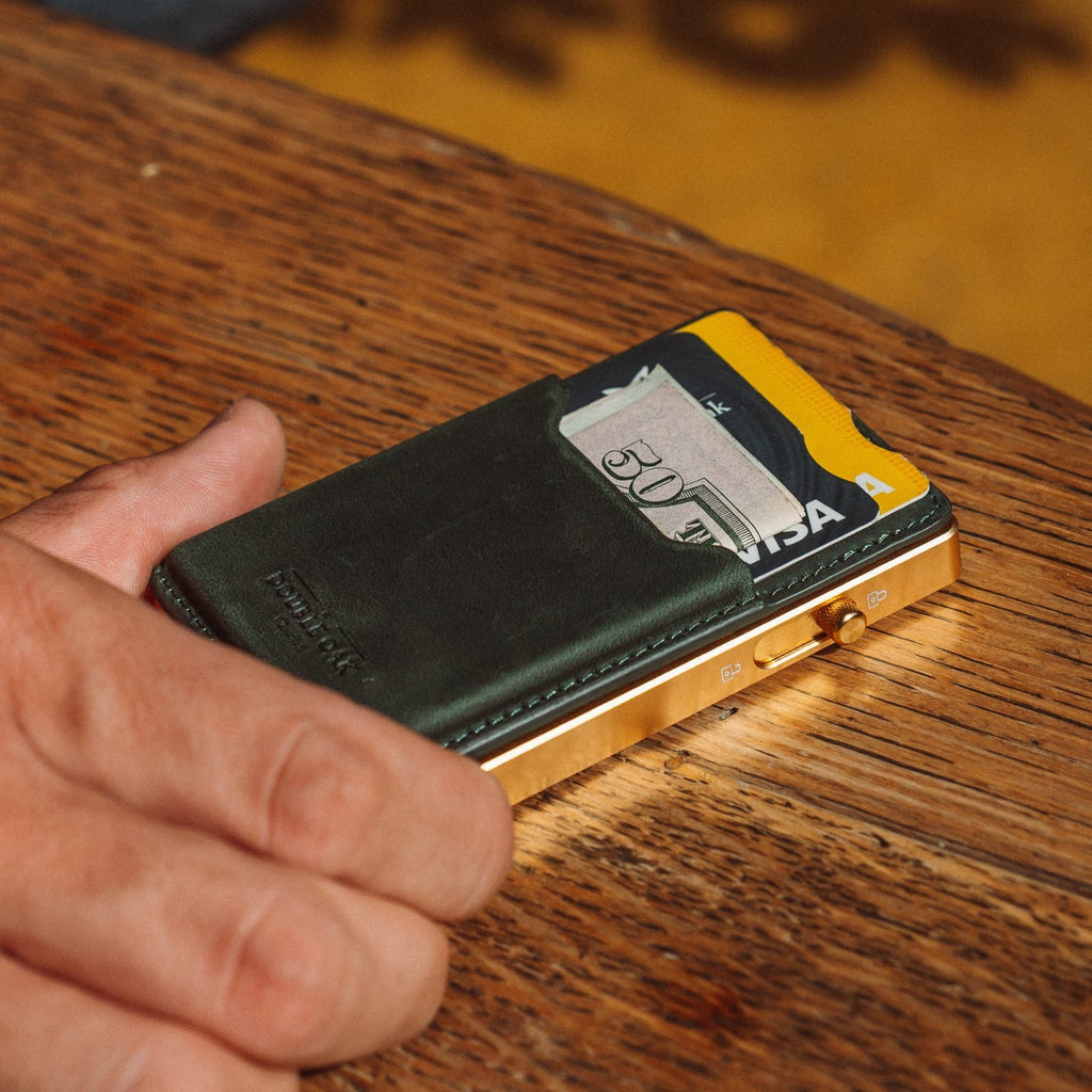Dark green leather card mod wallet with card pocket and gold-tone hinge