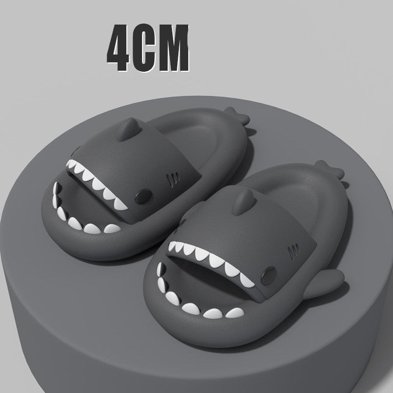 Dark grey shark slide sandals with white tooth trim and raised side fin