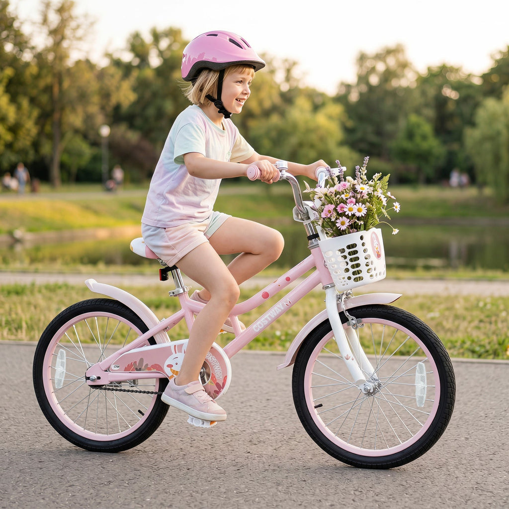 Kids 18-inch pink bike with training wheels, front basket, and child wearing helmet