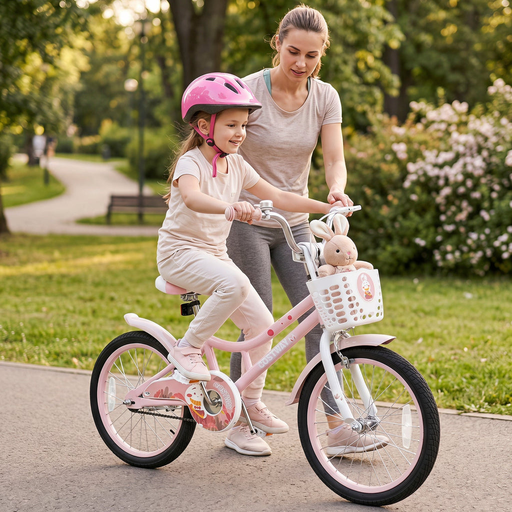 Pink 18-inch kids bike with training wheels and front basket, child riding with helmet