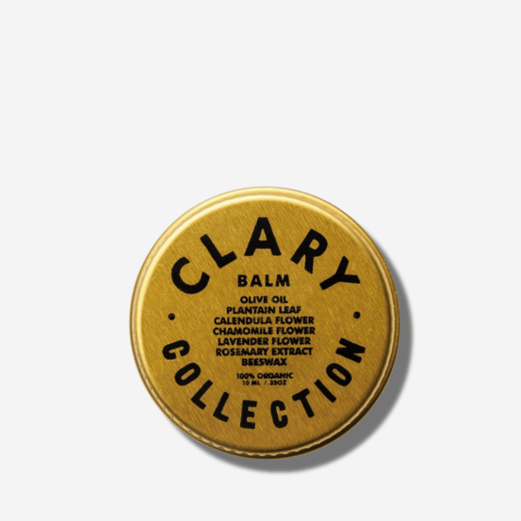 Olive balm tin with gold lid and circular brand label