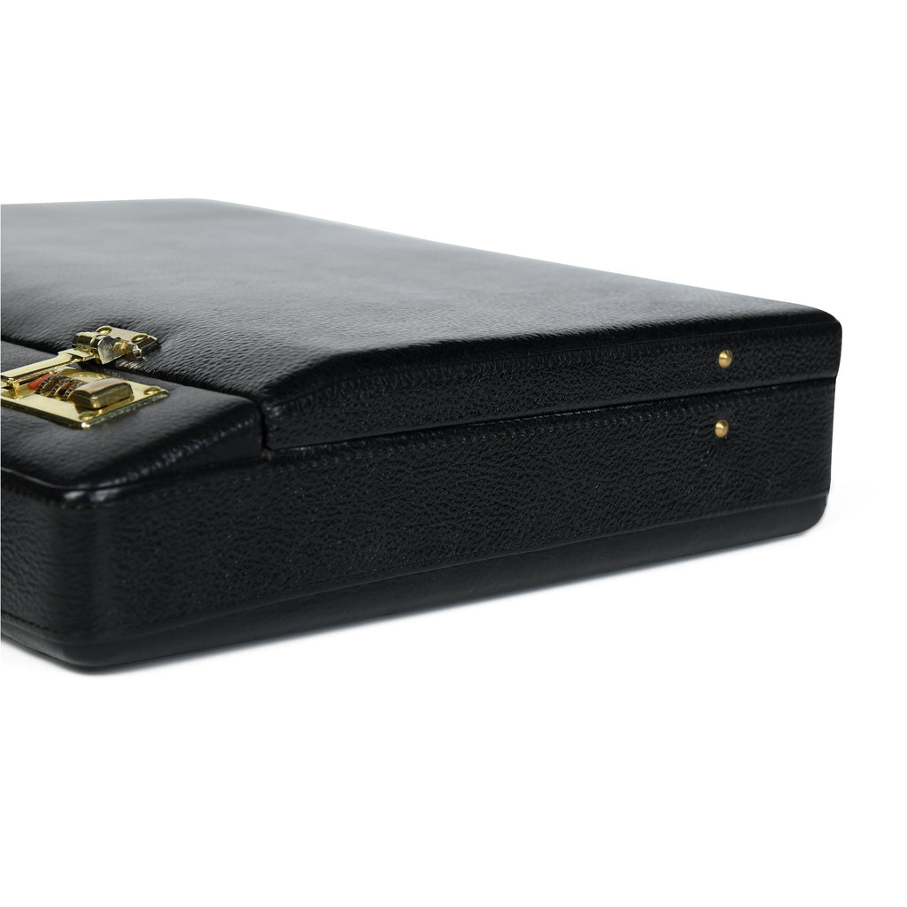 Black briefcase corner detail with gold-tone latch hardware