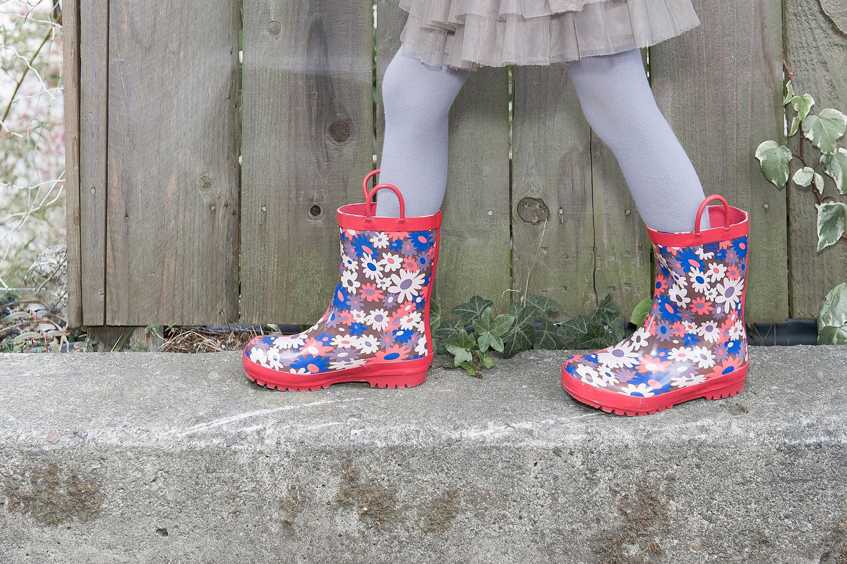 Pair of floral rain boots with red trim and multicolor flower print