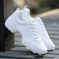 Pair of white mesh lace-up sports shoes with cushioned rubber sole