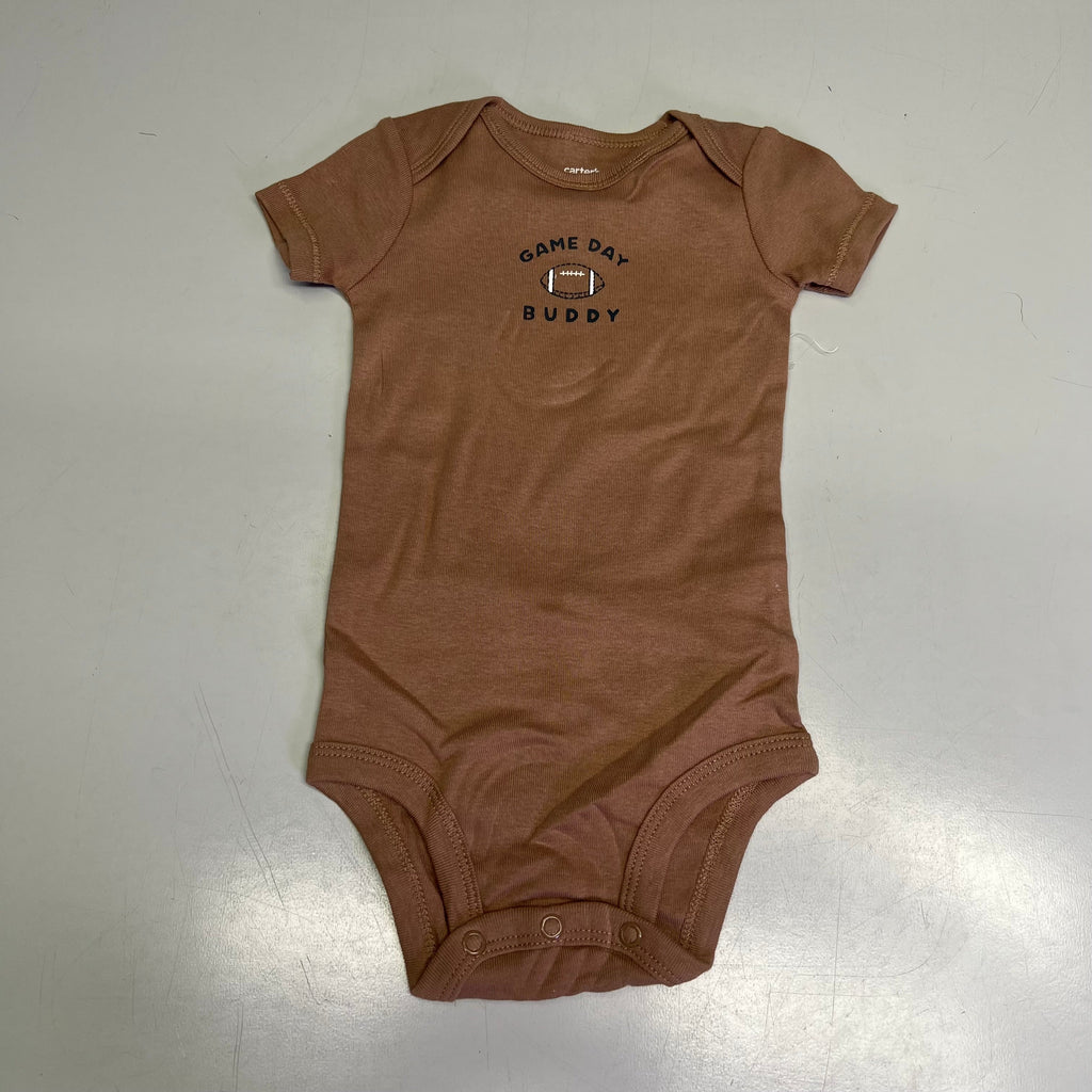 Baby boy brown short-sleeve snap onesie with “Game Day Buddy” graphic.