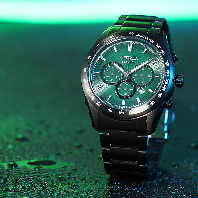 Men's chronograph watch with green dial and black metal bracelet.