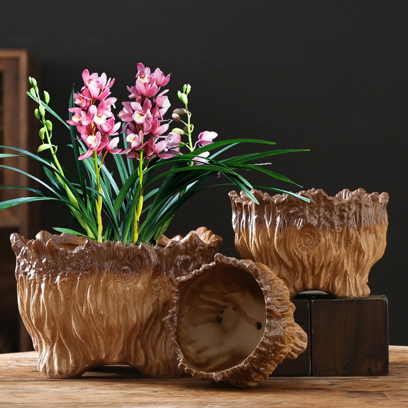 Ceramic flower pot with tree-root design, round side opening, and glossy brown glaze