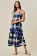 Navy and white abstract print midi dress with smocked bodice and tiered skirt