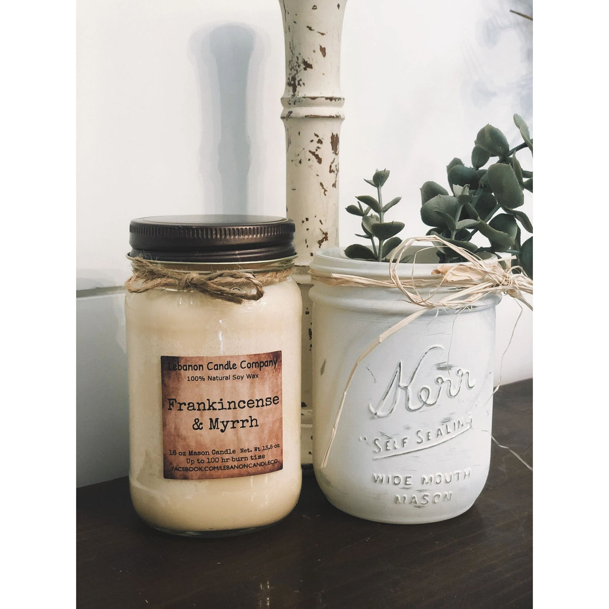 Frankincense & Myrrh soy candle jar with twine bow beside Kerr wide-mouth jar
