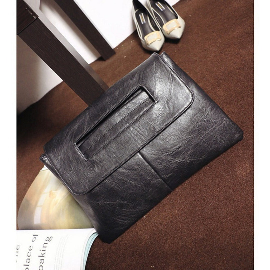 Black textured leather envelope clutch purse with front flap and long snap pocket