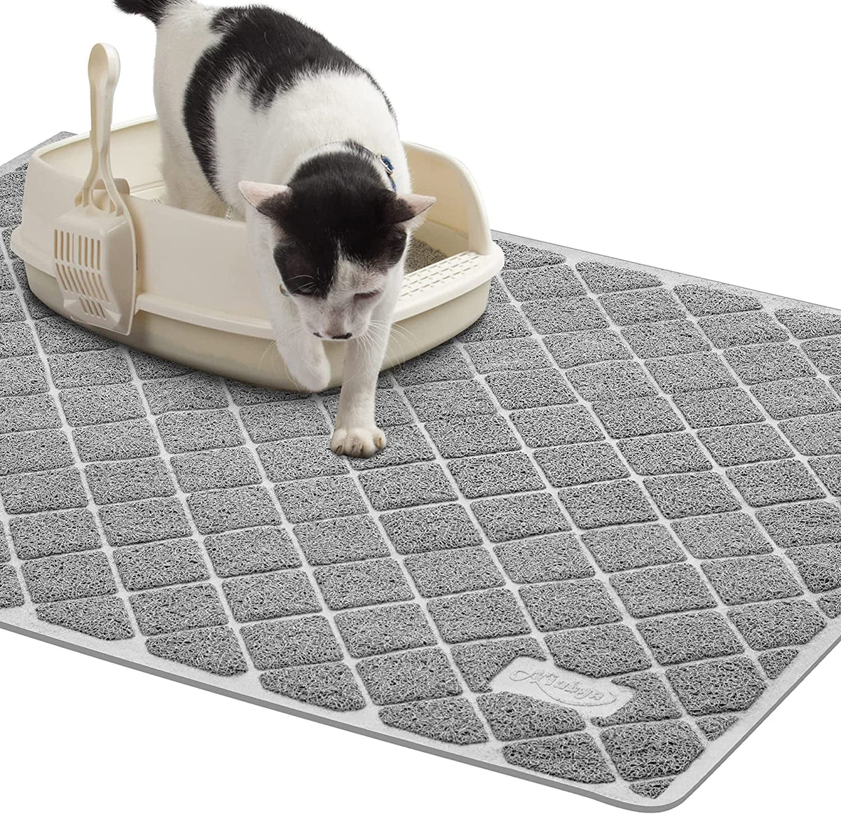 Gray cat litter mat with a diamond grid texture beside a litter box