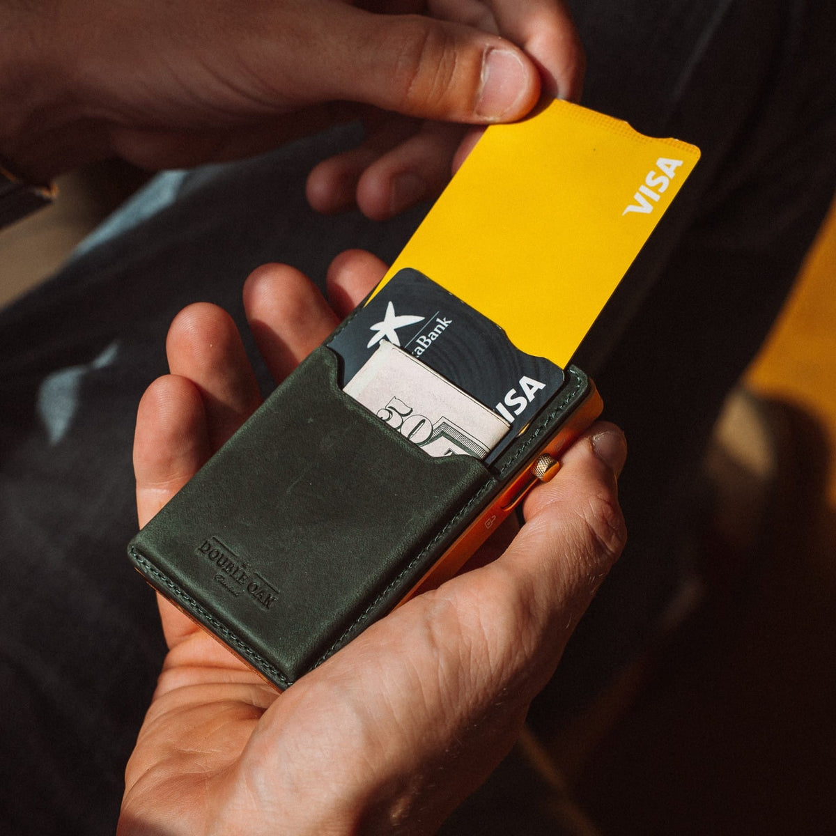 Dark green leather card mod wallet with card slots and gold-tone frame