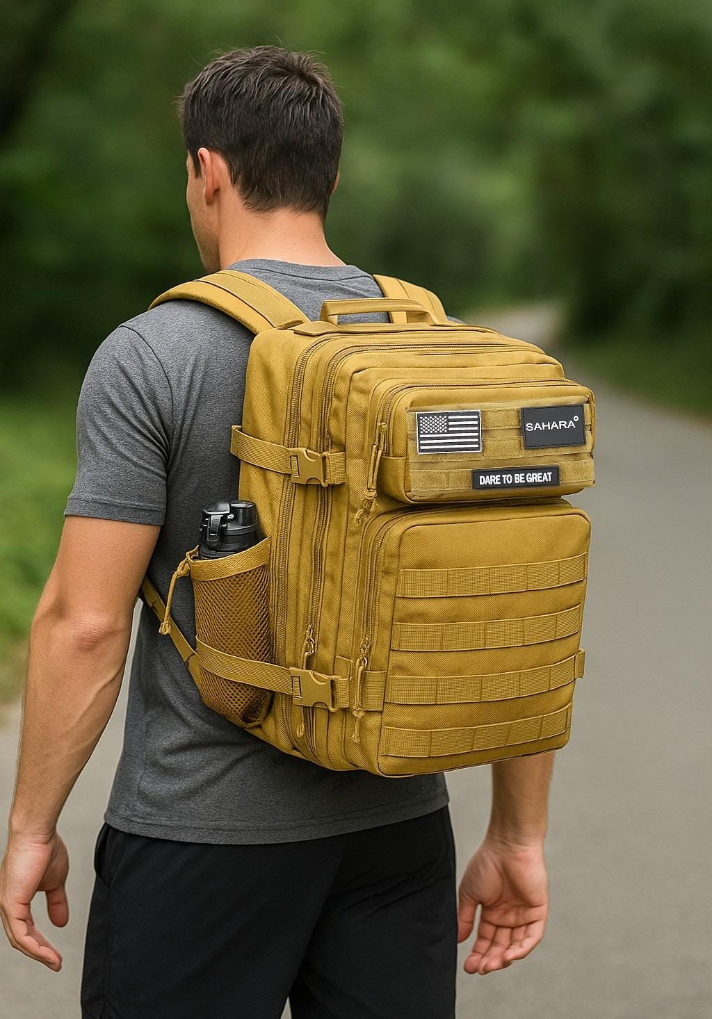 Khaki tactical backpack worn on person, with front organizer panel and side bottle holder