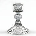 Faceted smoke-gray glass taper holder with ribbed top and flared base