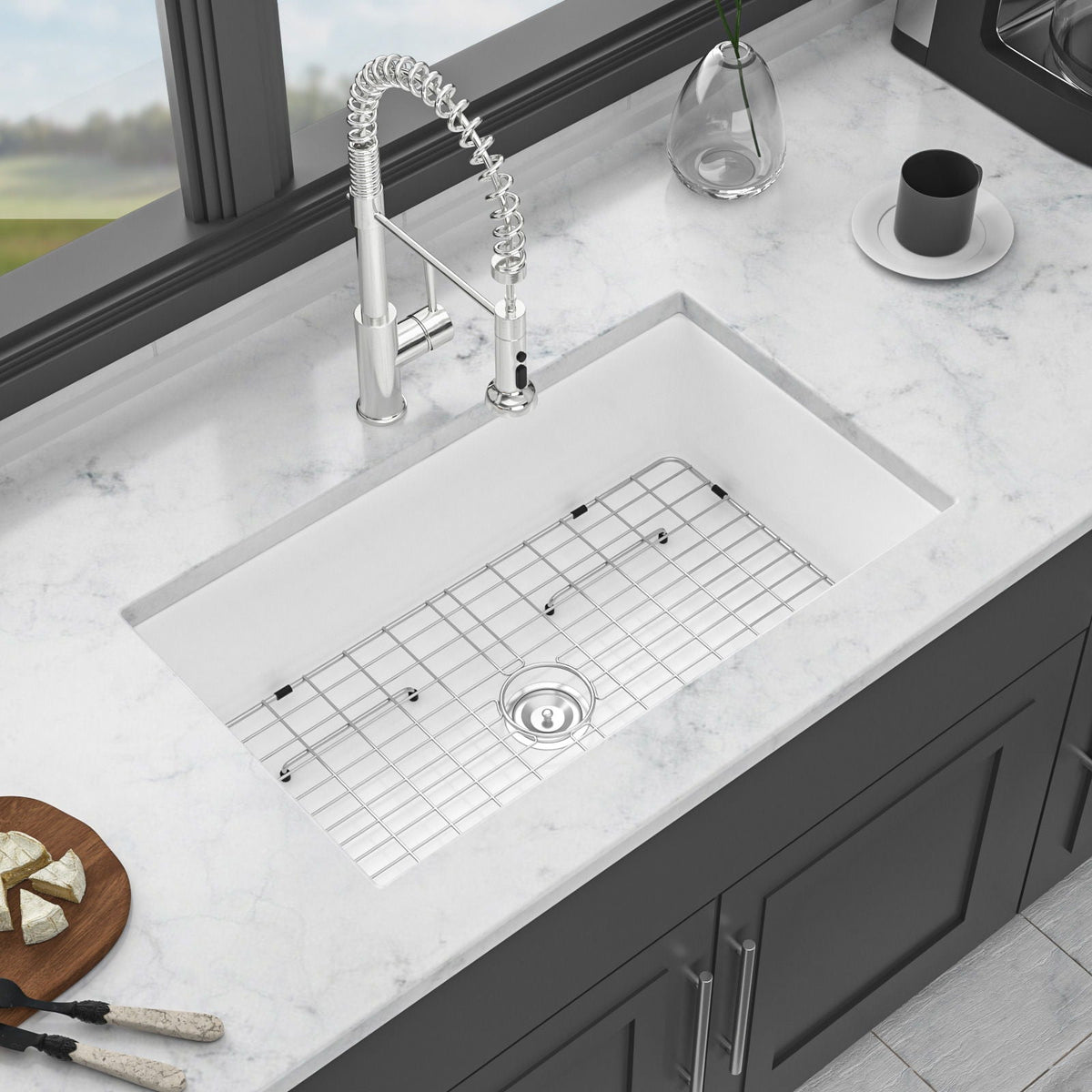 Ceramic single-bowl kitchen sink with wire rack, drain strainer, and faucet fixtures