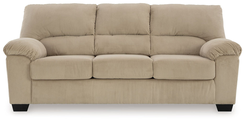 Beige sofa with tufted back cushions and rolled arms